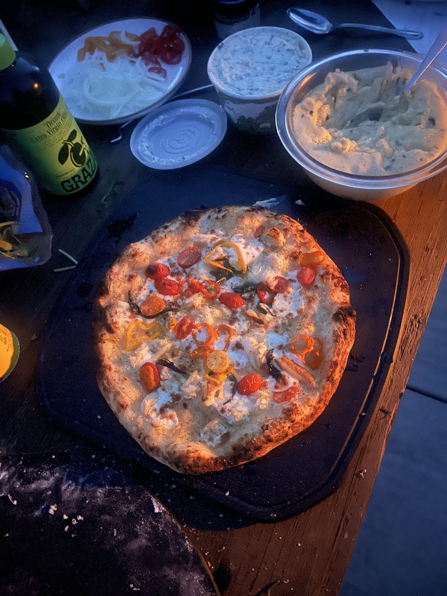 Cherry tomato and pepper pizza at golden hour
