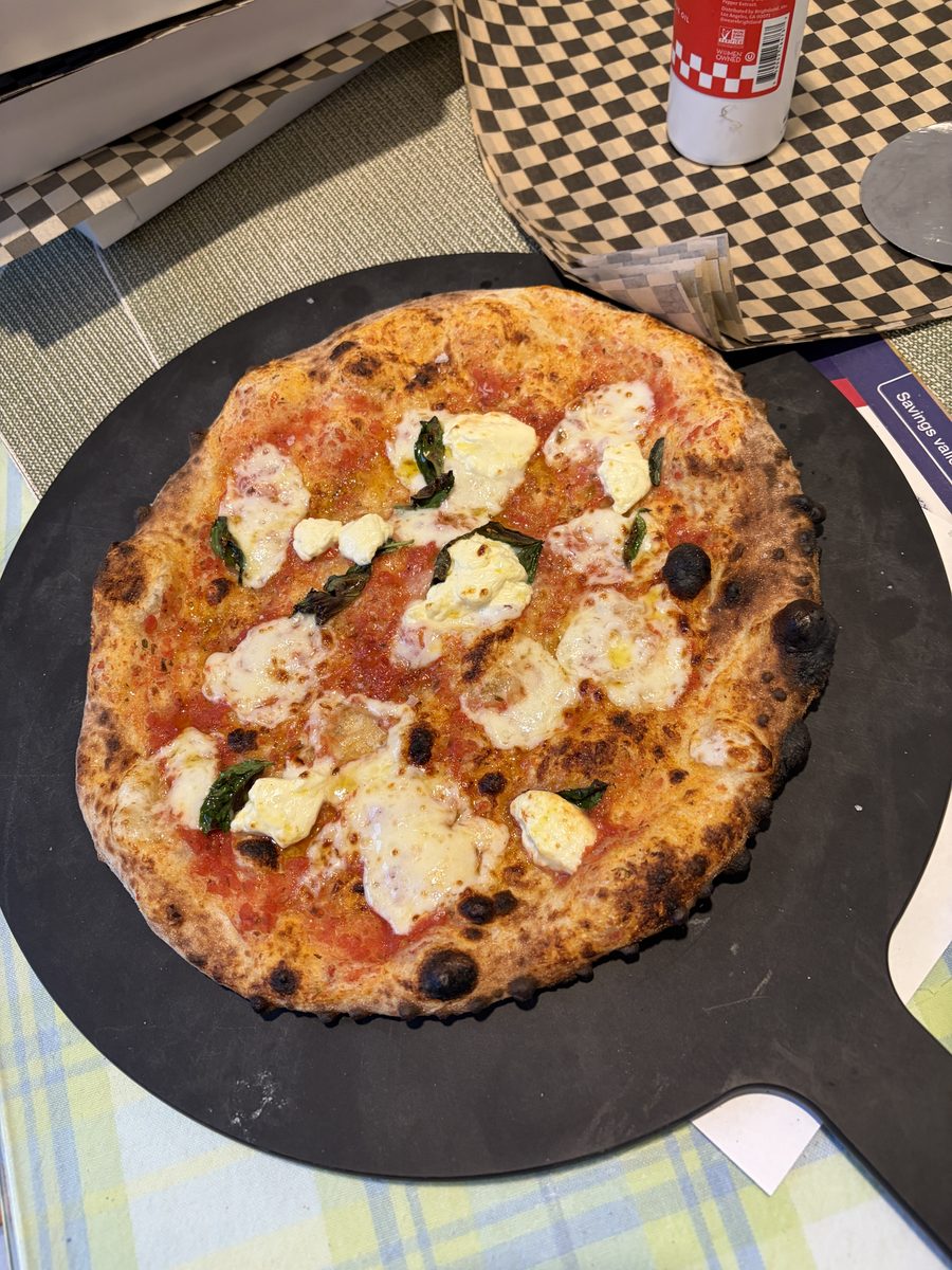Classic margherita on a pizza peel